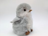Alpaca fur stuffed penguin sitting looking cute