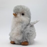 Alpaca fur stuffed penguin sitting looking cute
