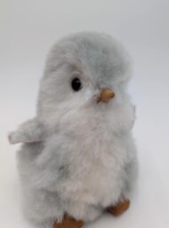 Alpaca fur stuffed penguin sitting looking cute